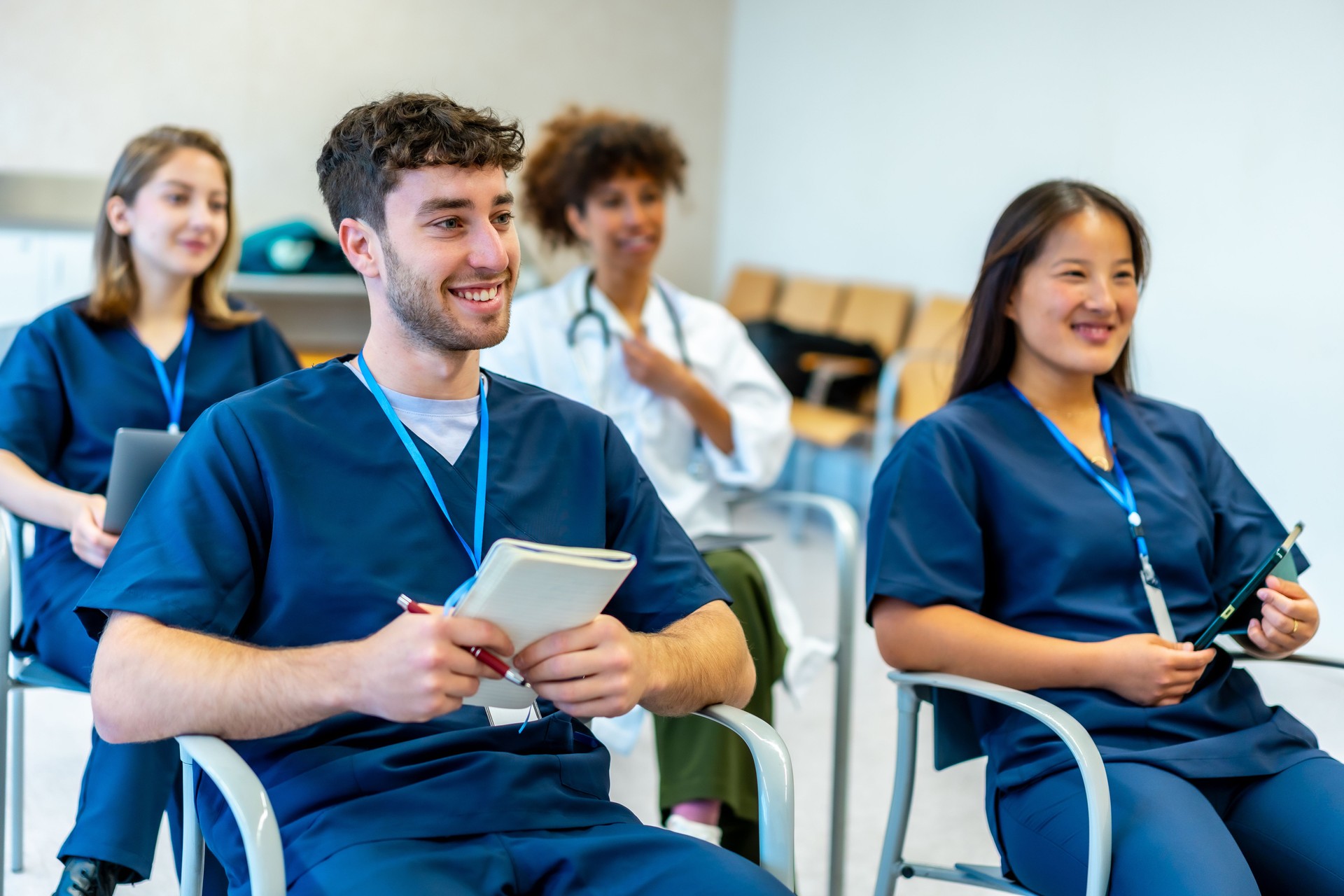 Medical students attending a lecture in university classroom